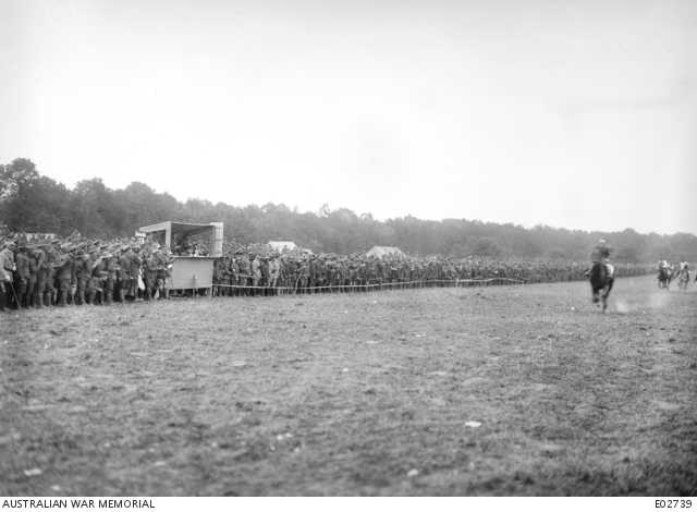 A large crowd watches the finish of a horse race at the 4th Australian Divisional Race meeting at Allonville.